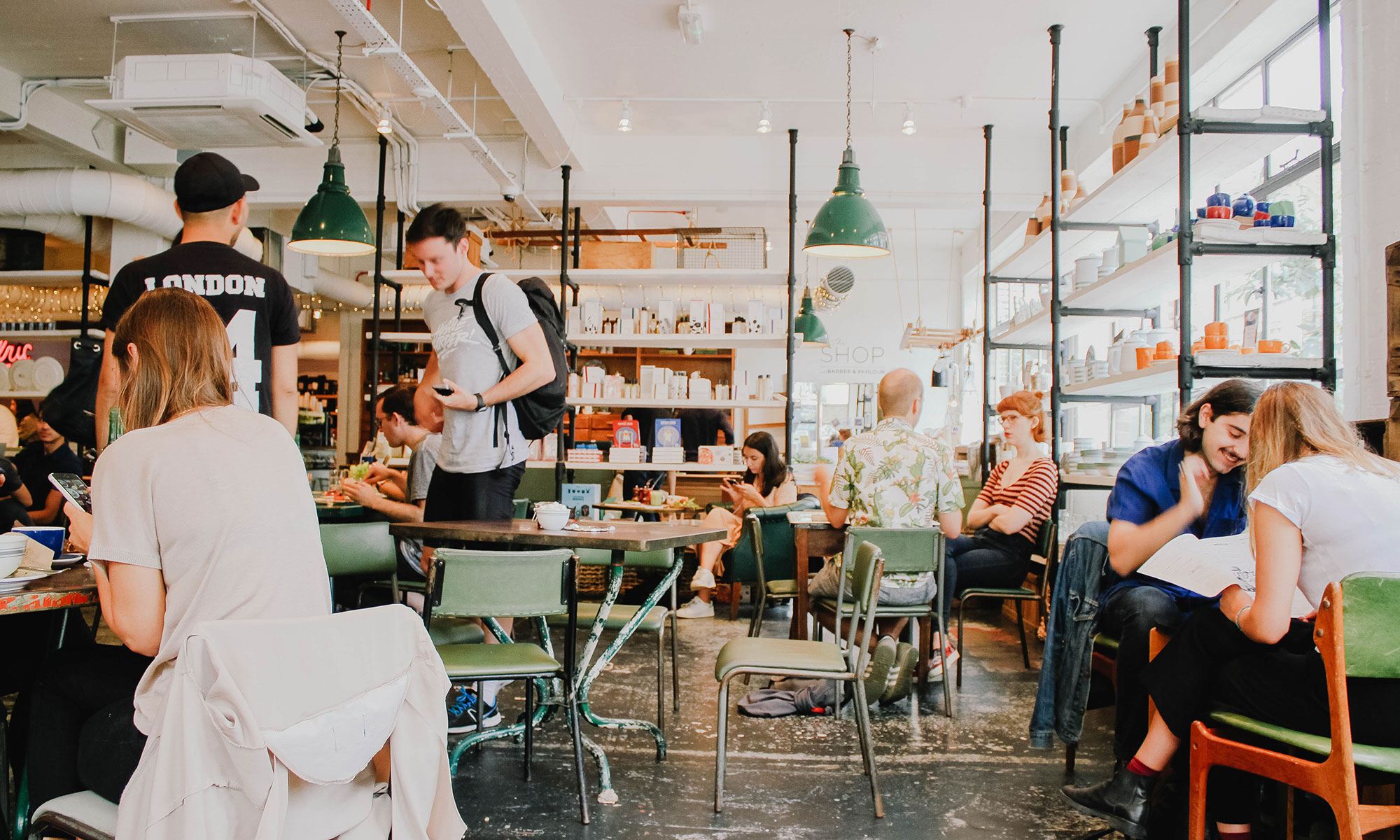 Cafe with patrons, tables and seating