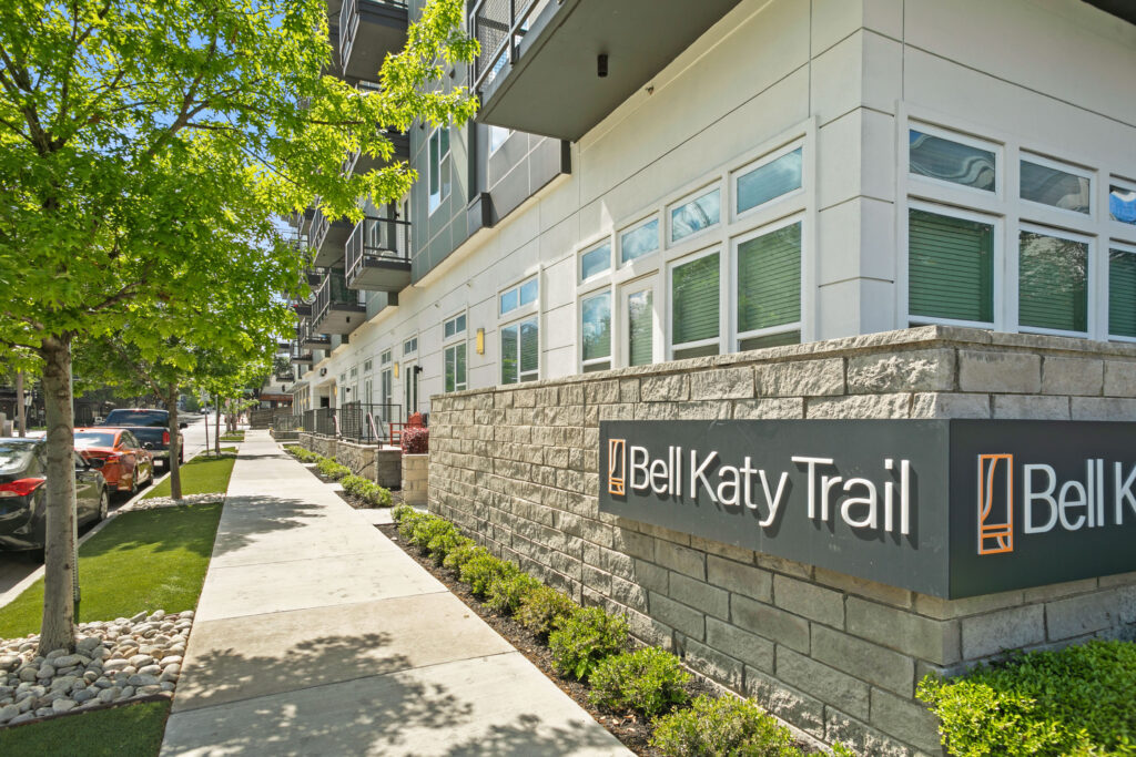 Leasing office entrance showing landscaped sidewalk