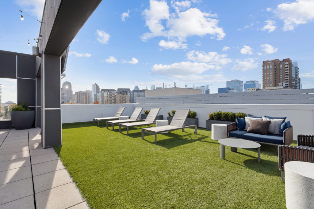Rooftop deck with lounge seating and TV