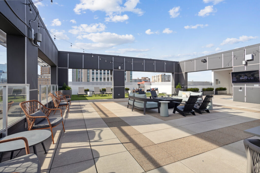 Rooftop deck with lounge seating and TV