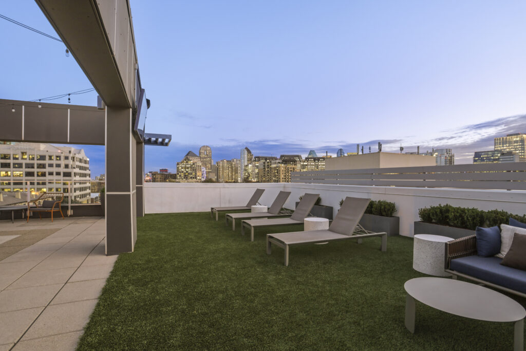 Rooftop lounge with fire pit and TV