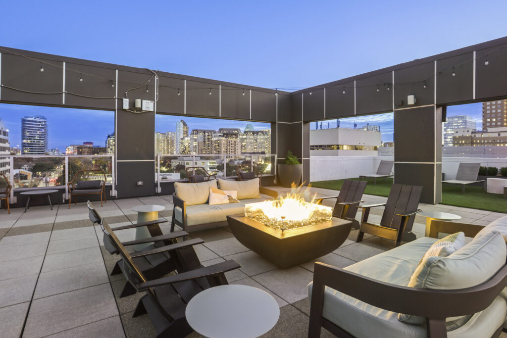 Rooftop lounge with fire pit and TV