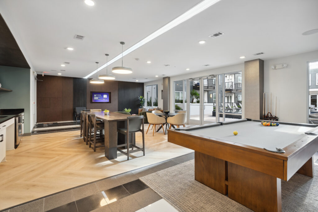 Clubhouse lounge with billiards and TV